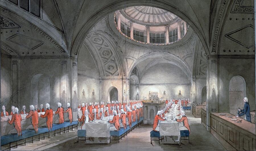 Guests gather at enormous long tables for a banquet in the central hall of Soane's Bank of England.
