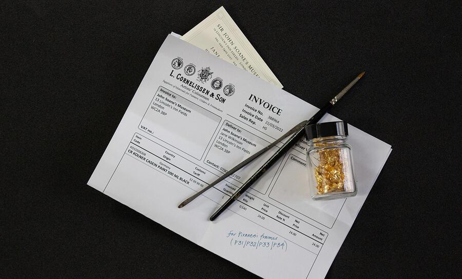 The modern time capsule, now hidden in the Museum, including a small jar of gold leaf, brushes, and paperwork.